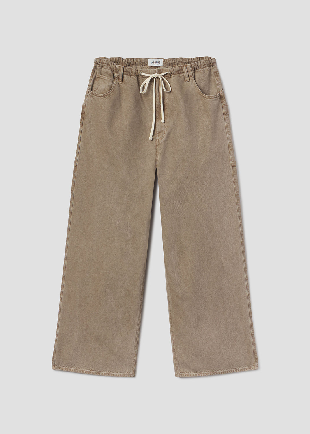 Beige pants with a drawstring on a light gray background