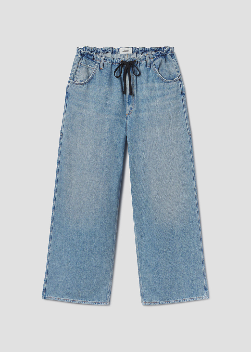 Blue jeans with a drawstring on a light gray background