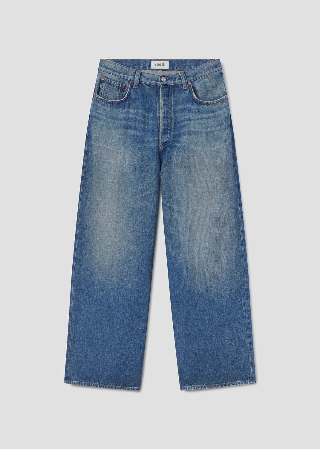 Pair of blue jeans on a light gray background