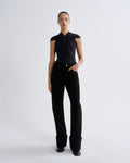 Person wearing a black outfit on a white background