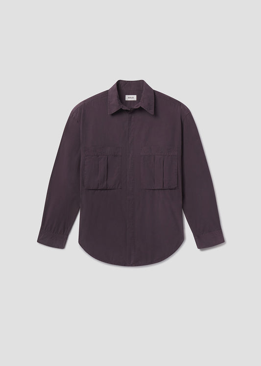 Dark purple shirt with two front pockets on a light gray background