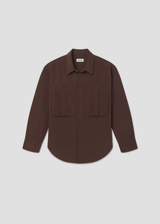 Brown shirt with two front pockets on a light gray background