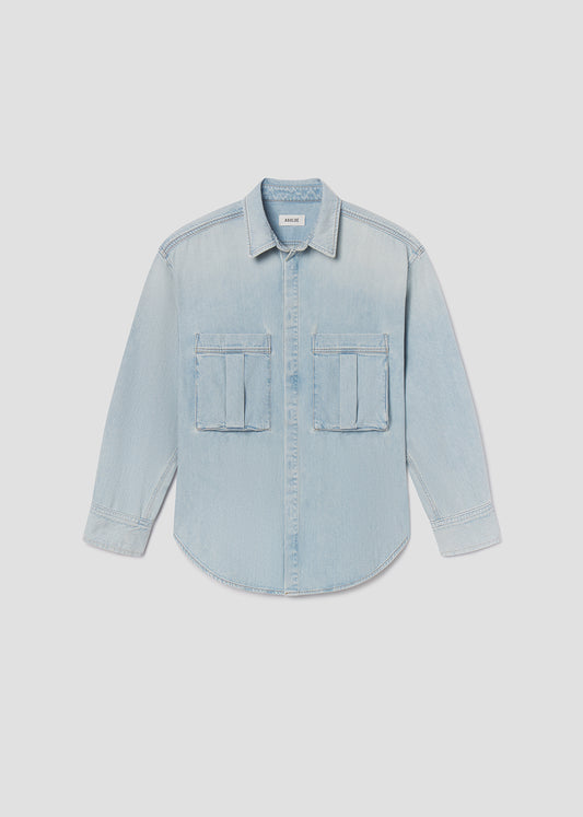 Light blue denim shirt on a light gray background