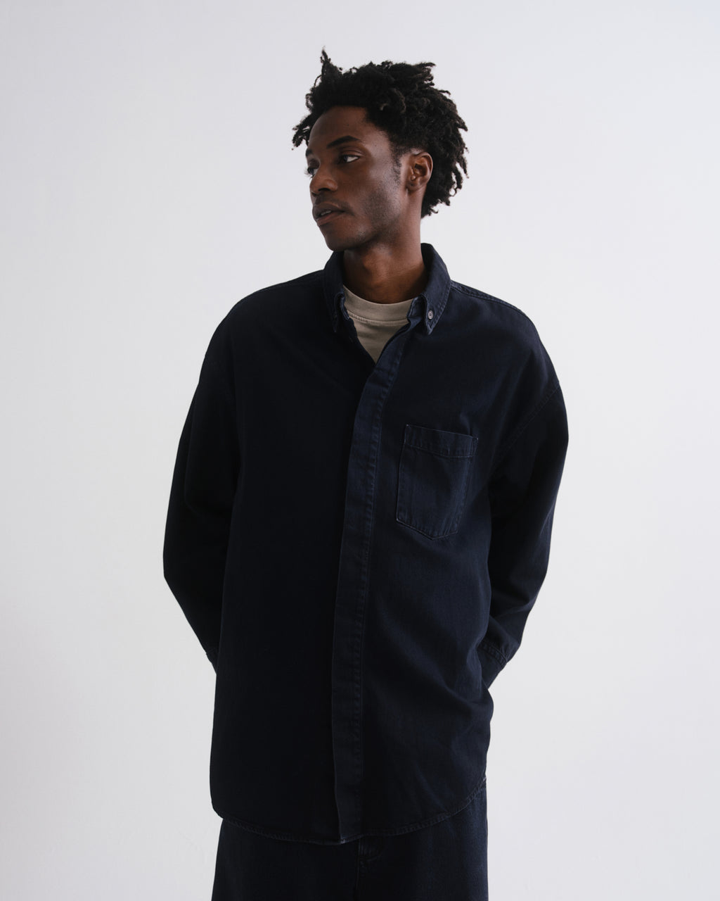 Person wearing a dark blue shirt with a great background