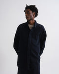 Person wearing a dark blue shirt with a great background