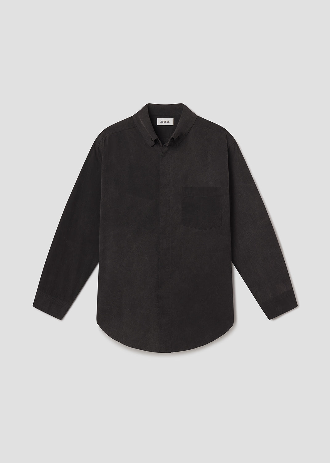 Flat lay shot of black shirt on a grey background