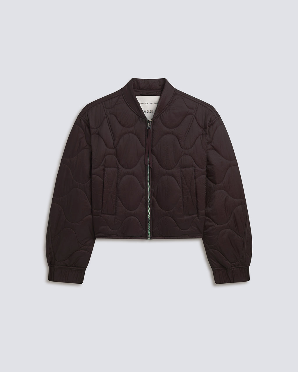 A dark brown cropped quilted bomber jacket with a wavy pattern, shown flat on a light gray background.