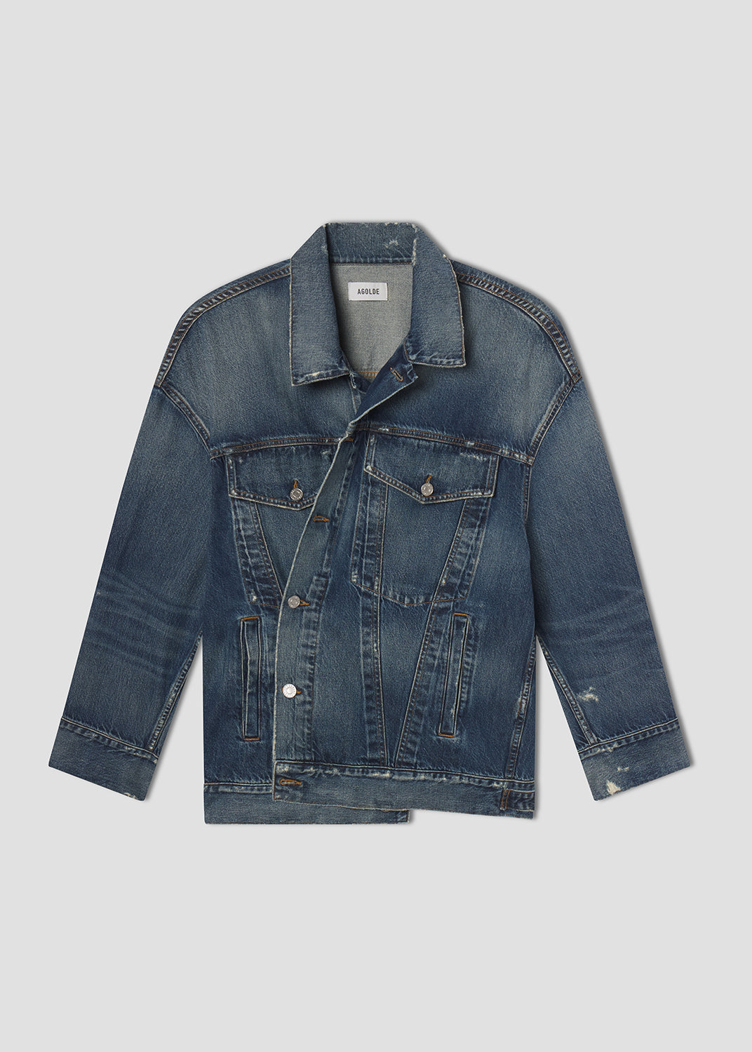 Blue denim jacket on a light gray background
