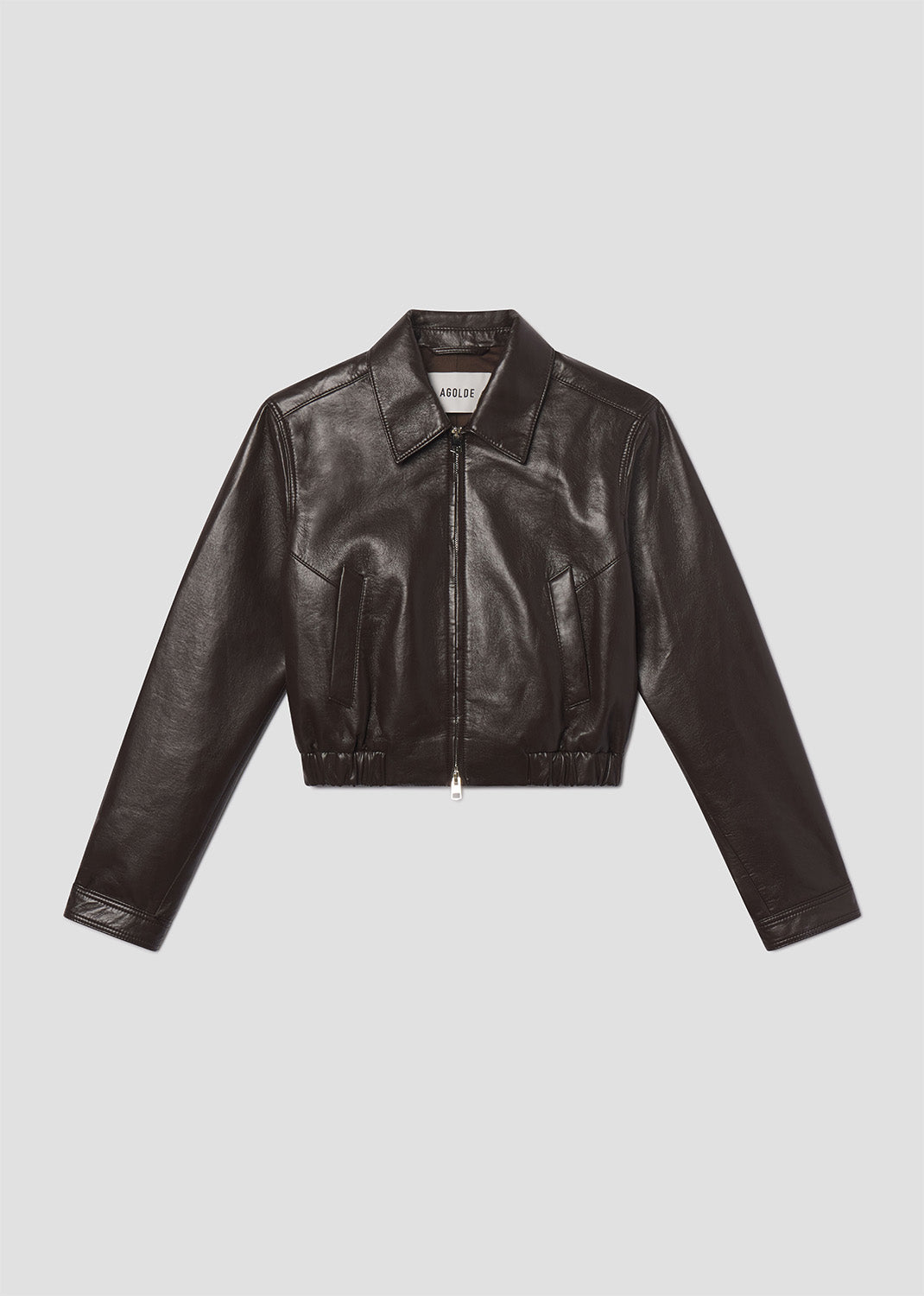 Black leather jacket on a light gray background