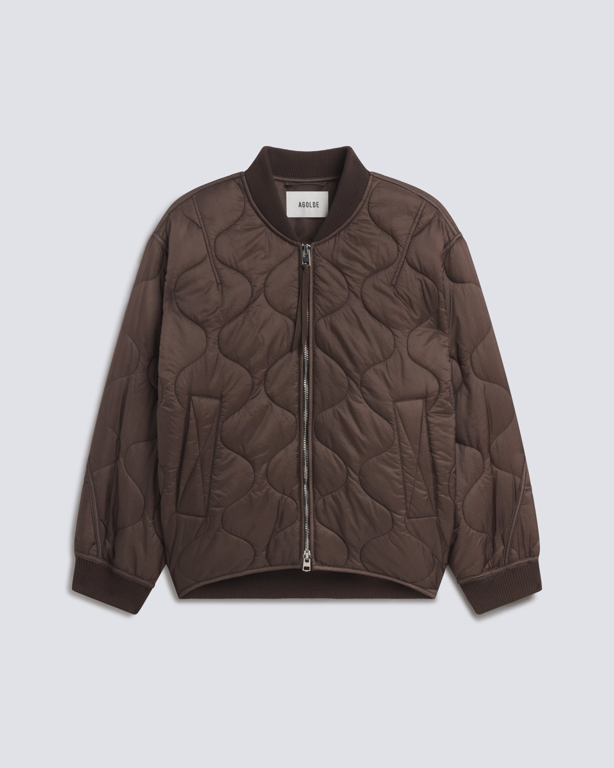 A dark brown quilted bomber jacket with a front zipper, ribbed collar, cuffs, and hem, displayed flat against a light gray background.