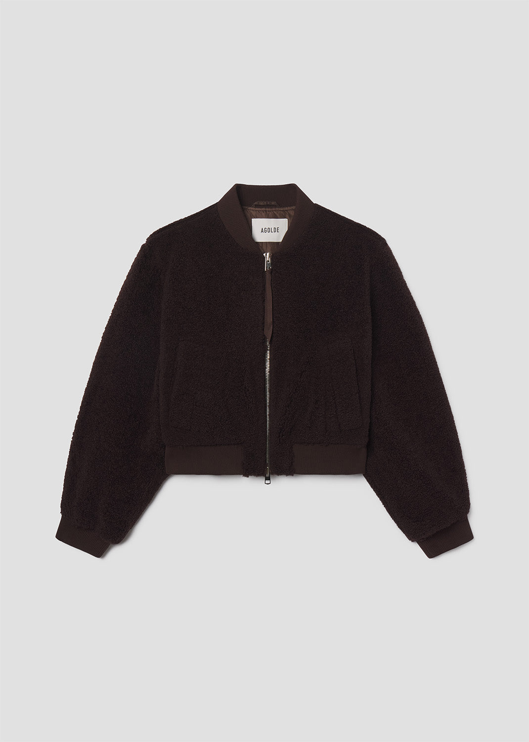 Black bomber jacket on a light gray background