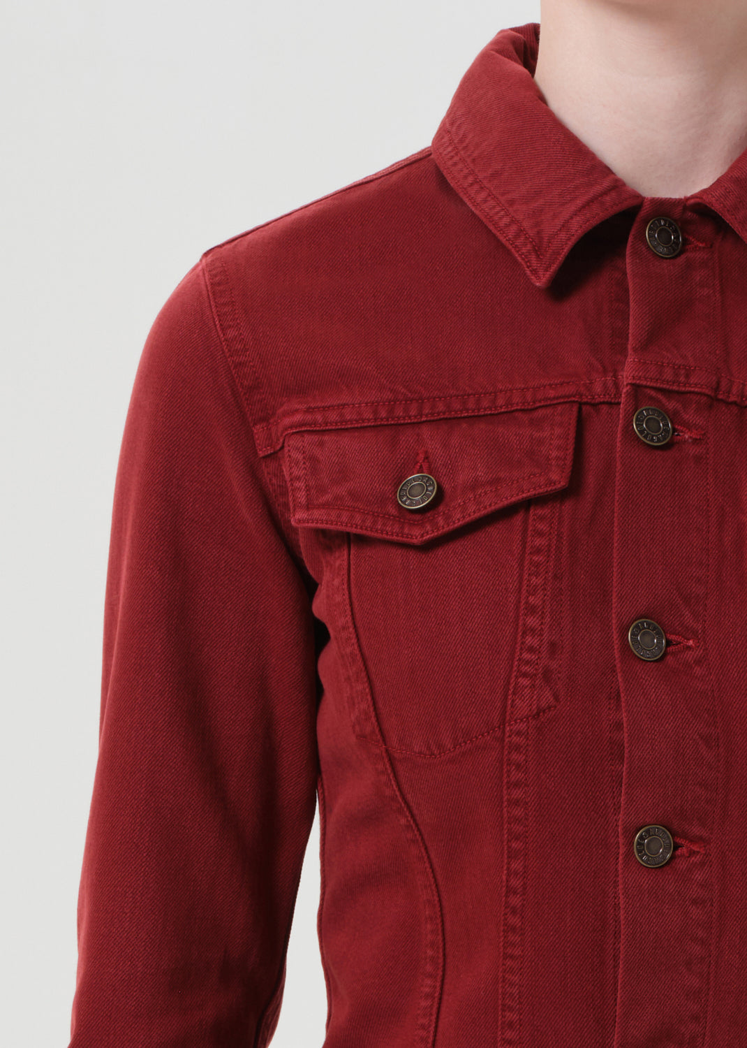 Red jacket with button details on a white background