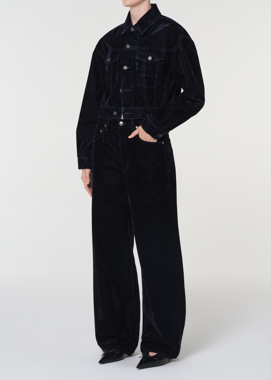 Blue corduroy jacket and pants on a white background