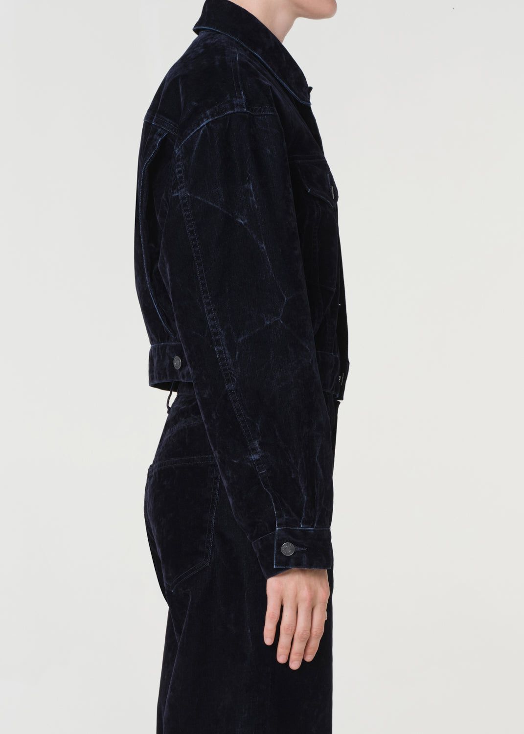 Blue corduroy jacket and pants on a white background