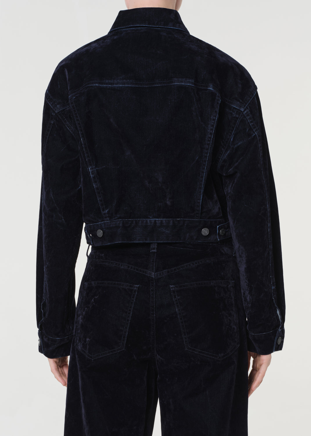 Blue corduroy jacket and pants on a white background