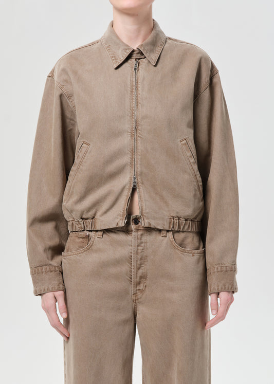 Front close up of person wearing brown jacket