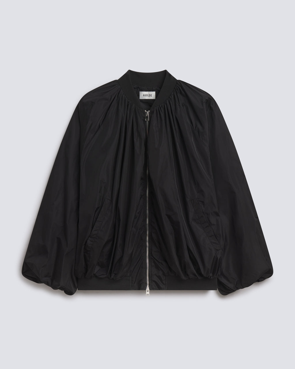A black lightweight bomber jacket with a gathered front, zippered closure, and balloon sleeves, shown flat on a light gray background.