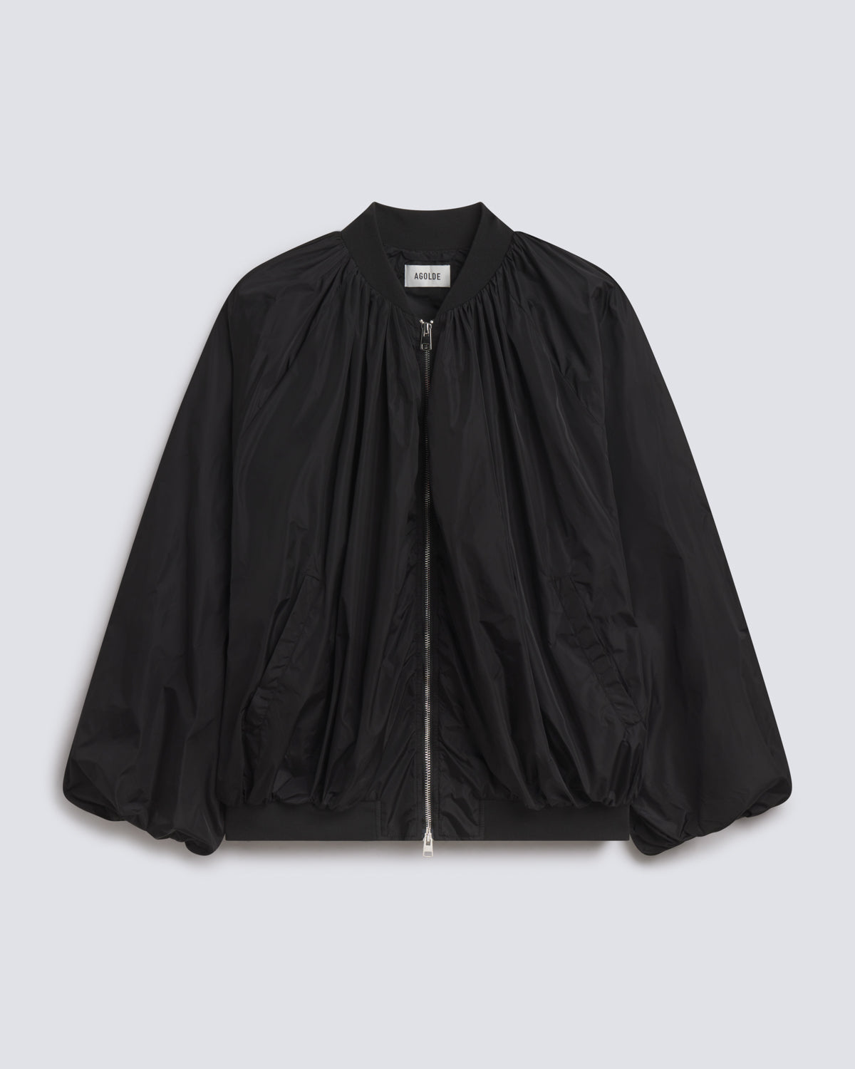 A black lightweight bomber jacket with a gathered front, zippered closure, and balloon sleeves, shown flat on a light gray background.