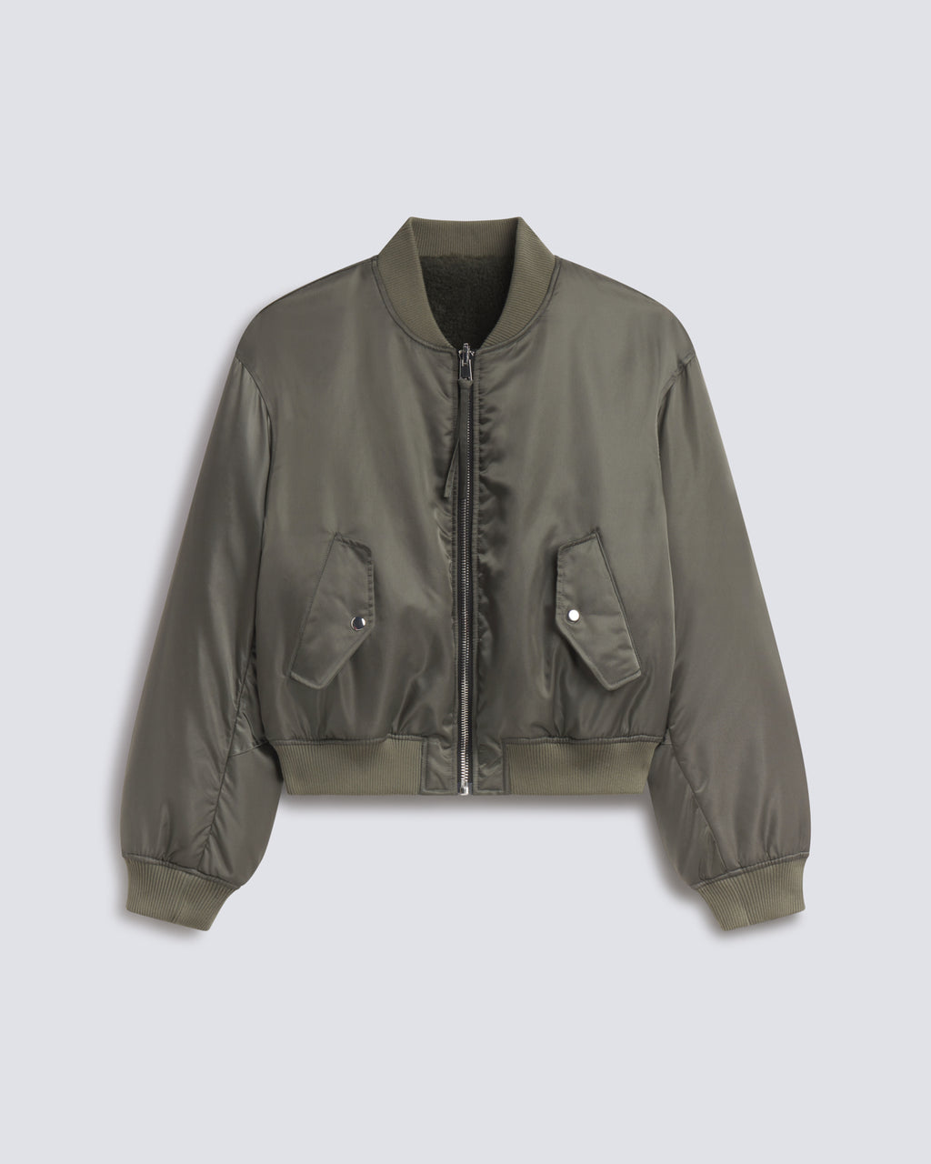 An olive green nylon bomber jacket with a front zipper, ribbed collar, cuffs, and hem, featuring two front flap pockets, displayed against a light gray background.
