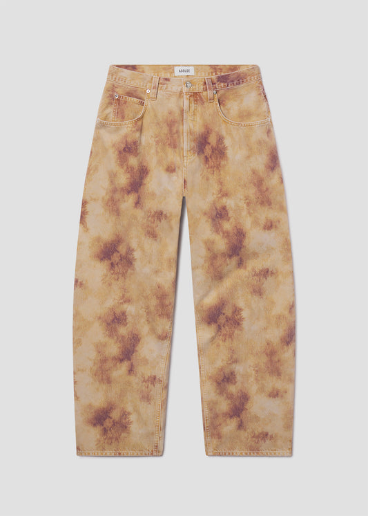 Tie-dye jeans on a light gray background