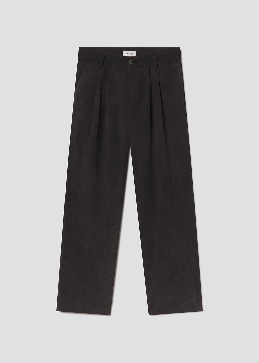 Flat lay of black pants on a grey background