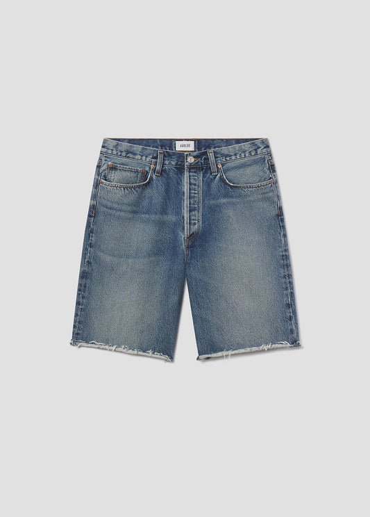 Blue denim shorts on a light gray background