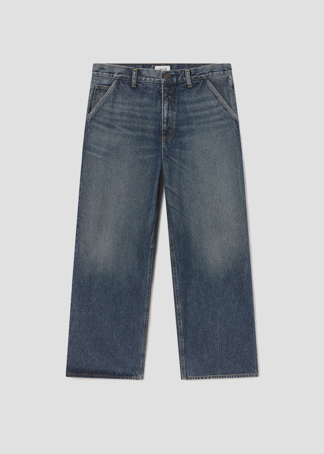 Pair of blue jeans on a light gray background