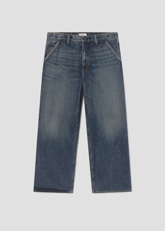 Pair of blue jeans on a light gray background