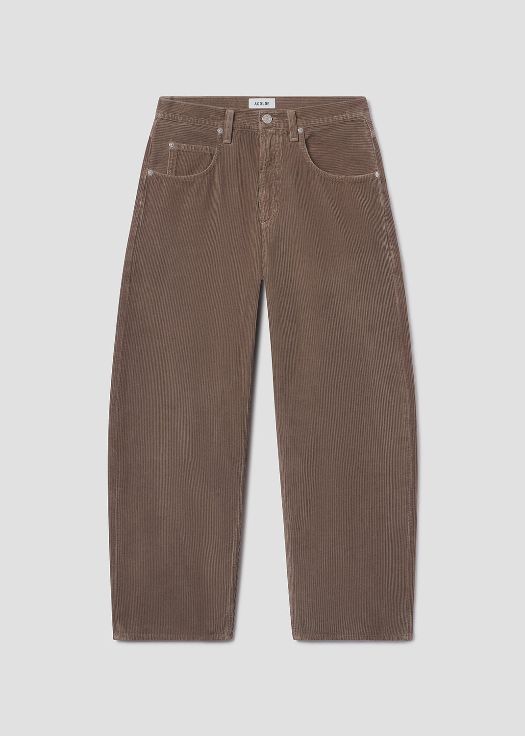 Flat lay shot of brown jeans on a grey background