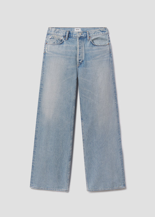 Light blue jeans on a light gray background