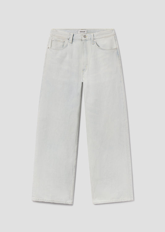 Light gray wide-leg jeans on a light gray background