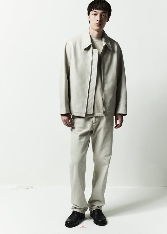 Person wearing a light gray suit on a white background