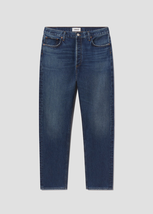 Blue jeans on a light gray background