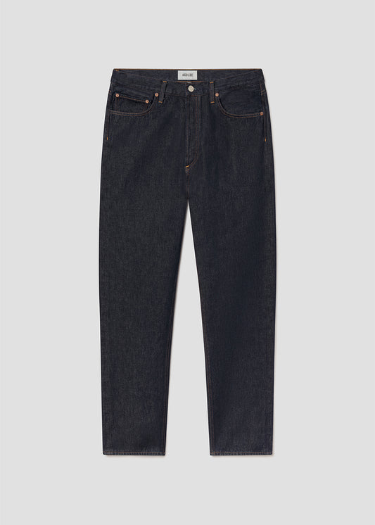 Dark blue jeans on a grey background