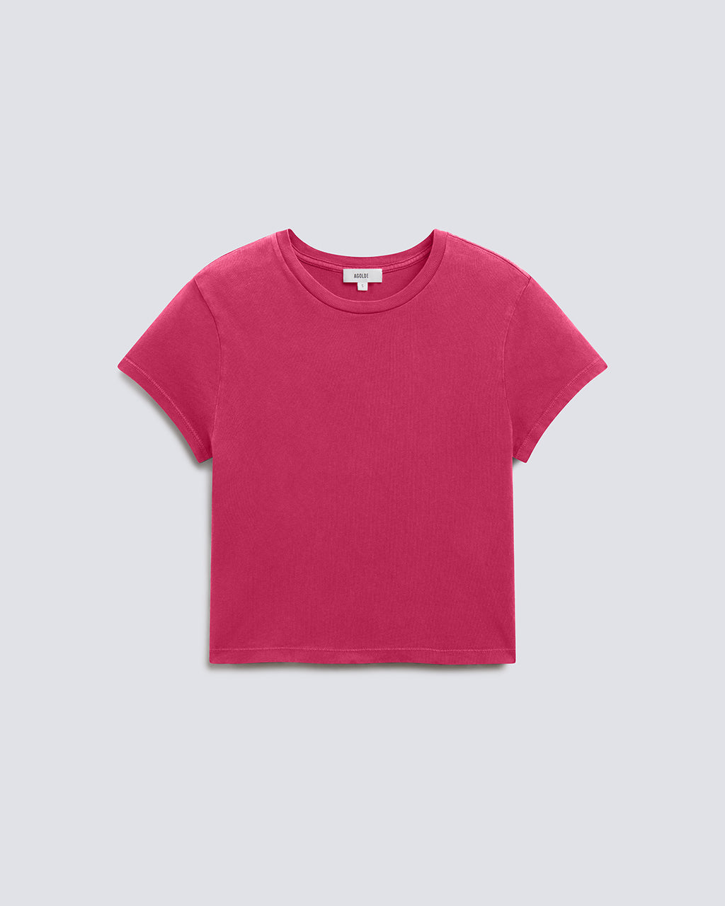 A bright pink short-sleeve crewneck t-shirt laid flat against a light gray background.