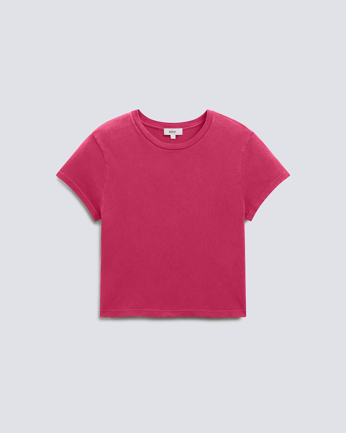 A bright pink short-sleeve crewneck t-shirt laid flat against a light gray background.