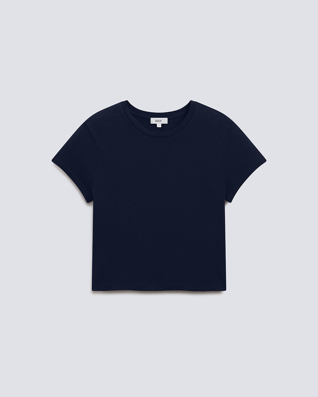A cropped short-sleeve crewneck t-shirt in solid navy blue, displayed flat against a light gray background.