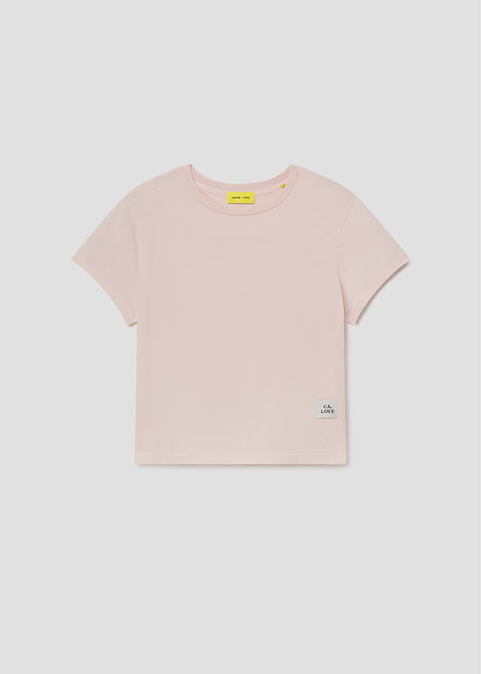 Pink t-shirt with brand logos on a light gray background