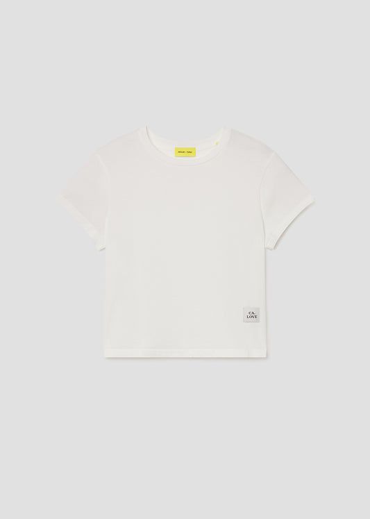 White t-shirt with a small logo on a white background