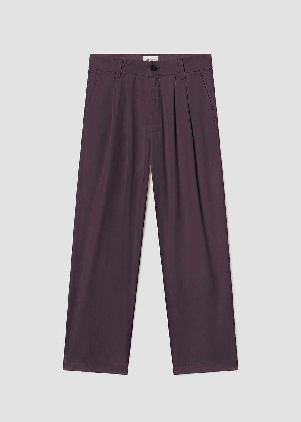 Purple pleated pants on a light gray background