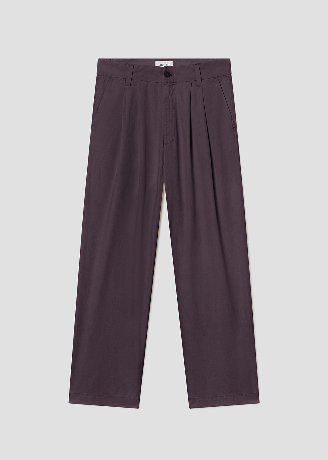 Purple pleated pants on a light gray background