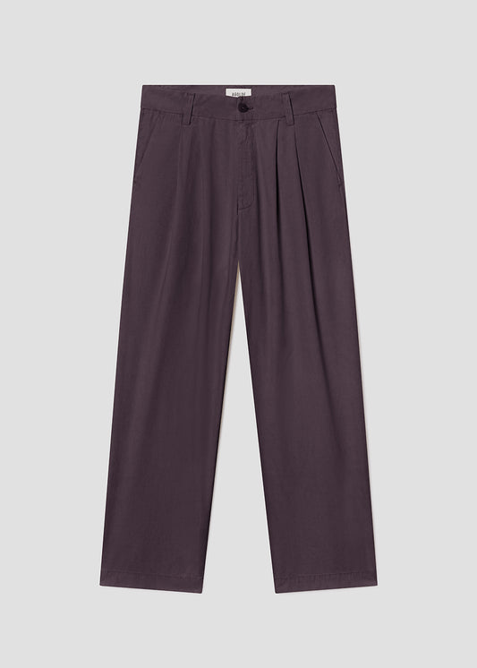 Purple pleated pants on a light gray background