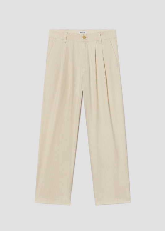 Beige pants on a light gray background