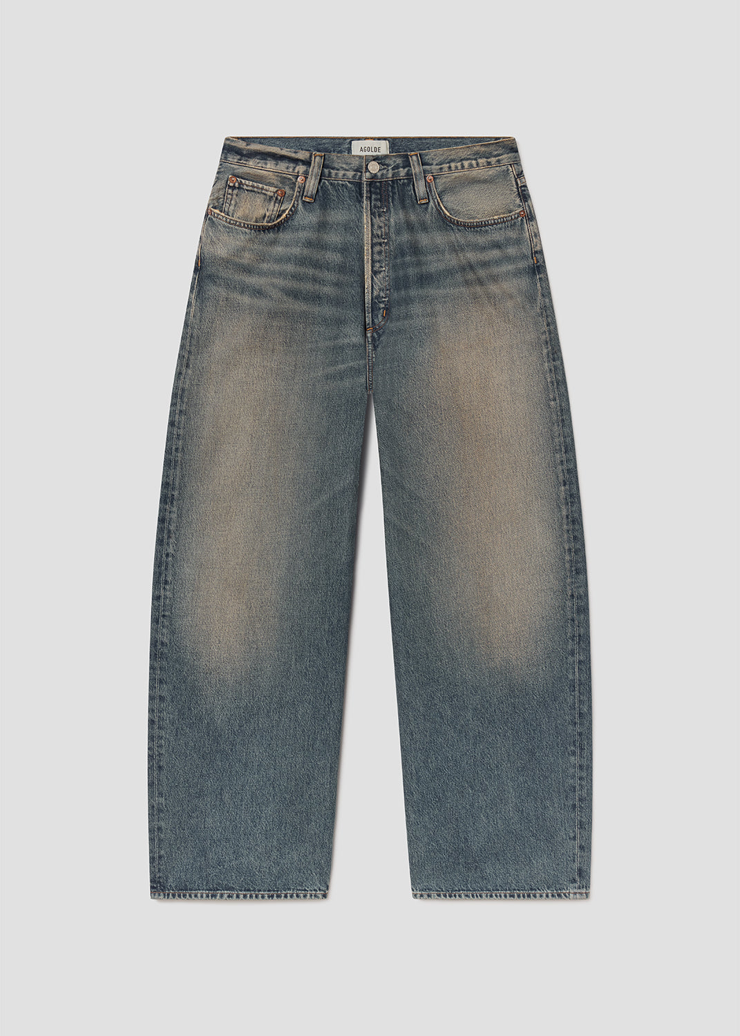 Flat lay shot of blue jeans on a grey background
