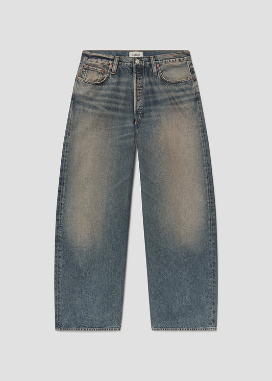 Flat lay shot of blue jeans on a grey background