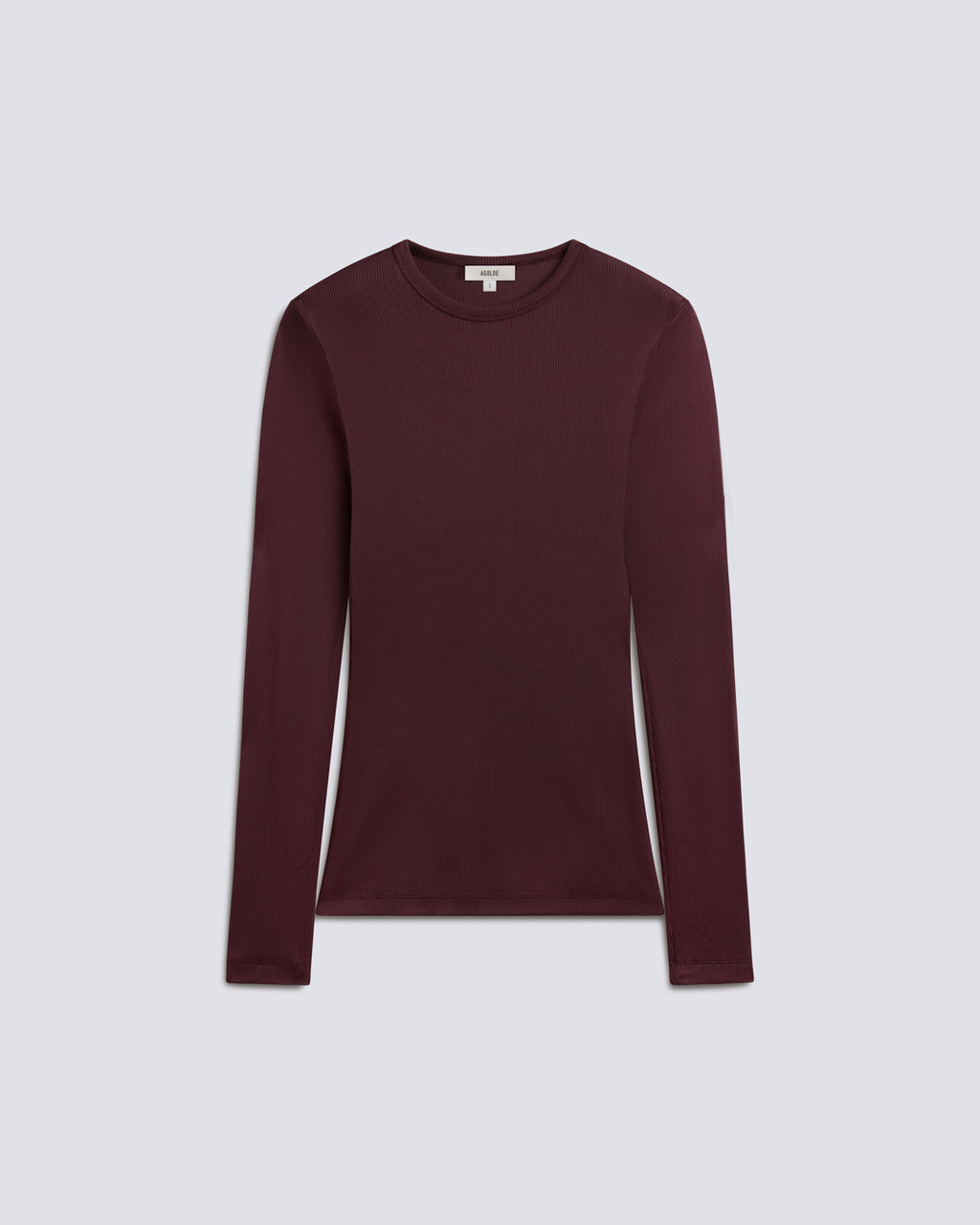 Flat lay of long sleeve burgundy shirt on a grey background