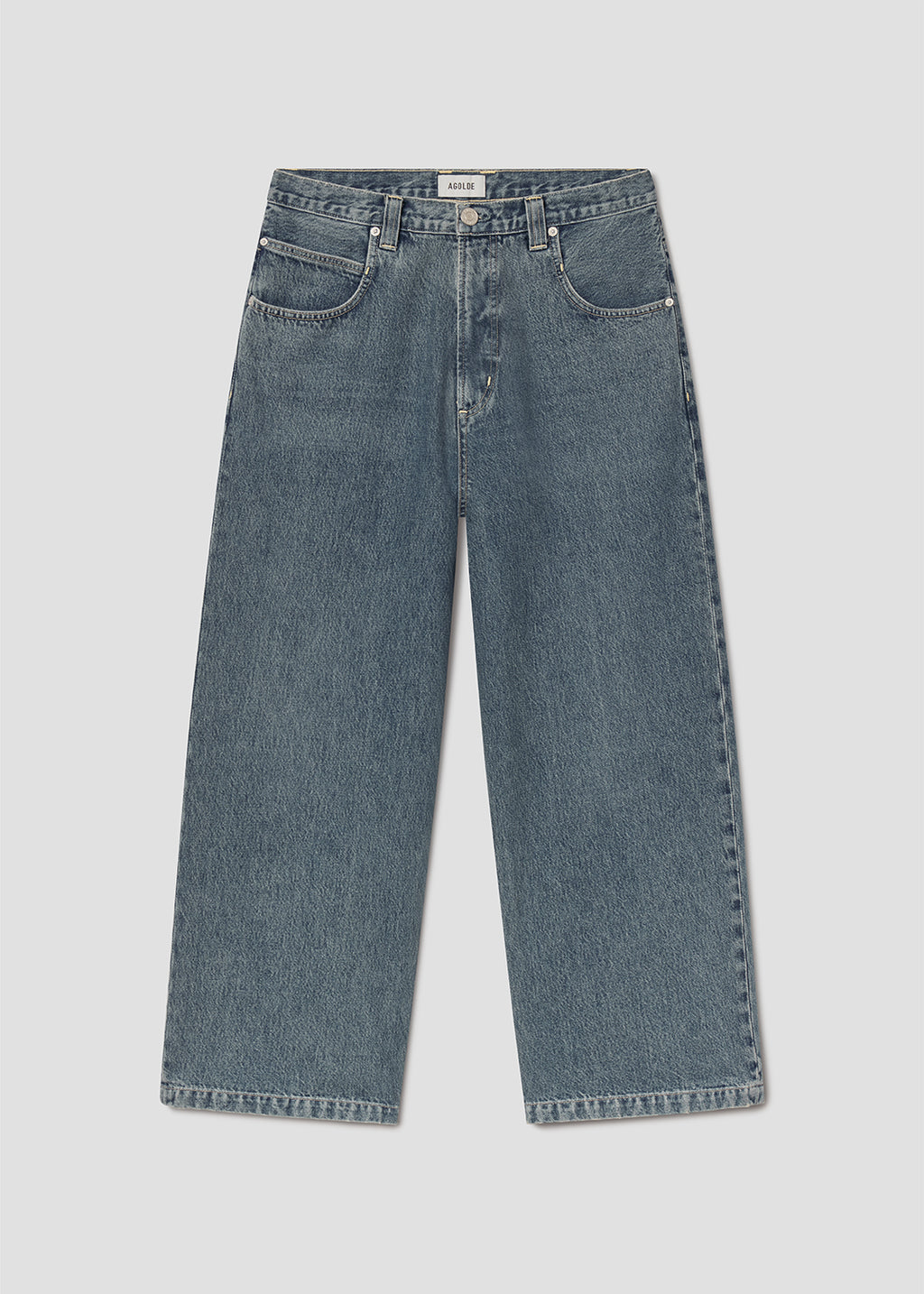Blue jeans on grey background