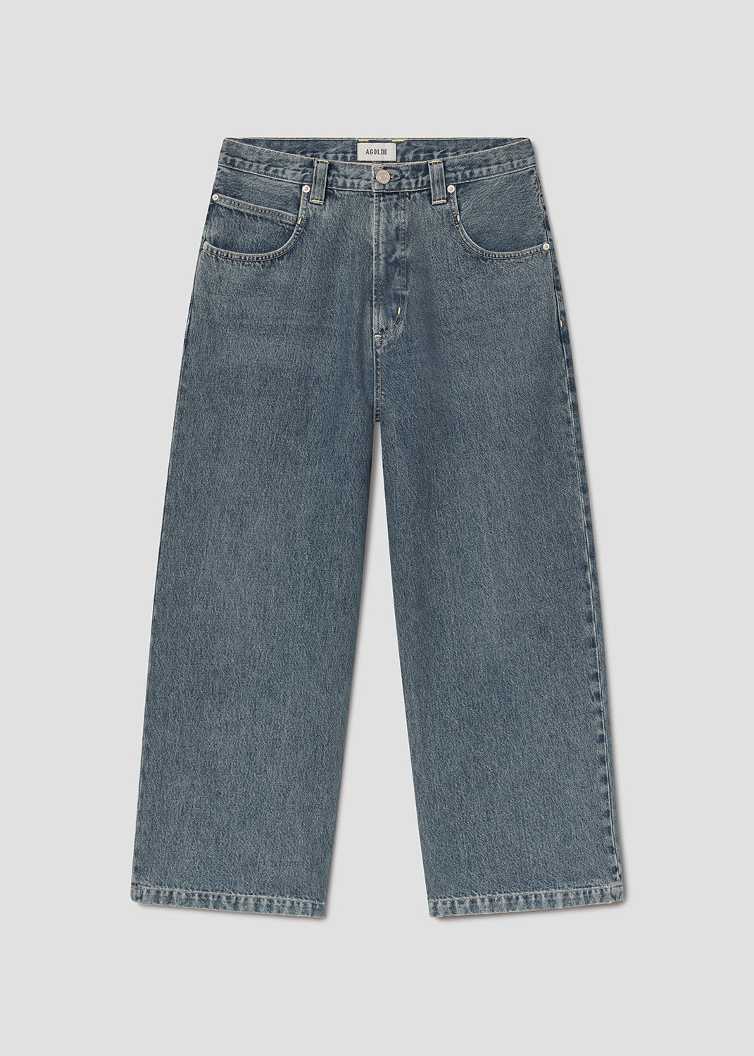 Blue jeans on grey background