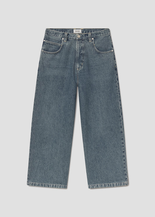 Blue jeans on grey background