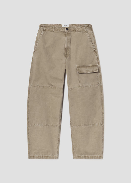 Beige cargo pants on a grey background